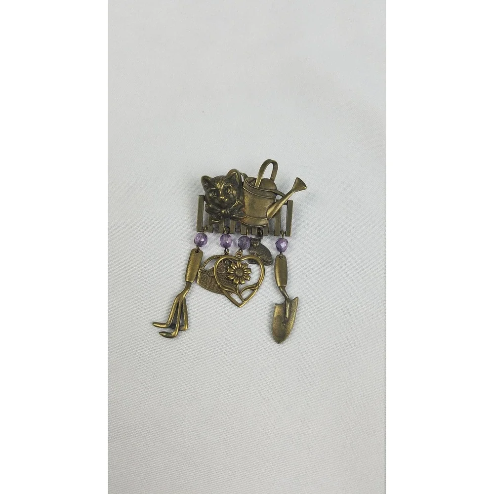 Vintage JJ brooch pin gold tone cat head on fence gardening tools
